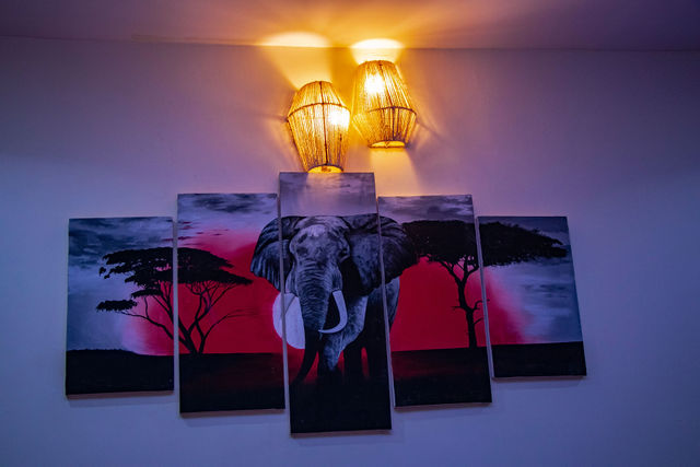 Hand-painted elephant artwork in a guest room